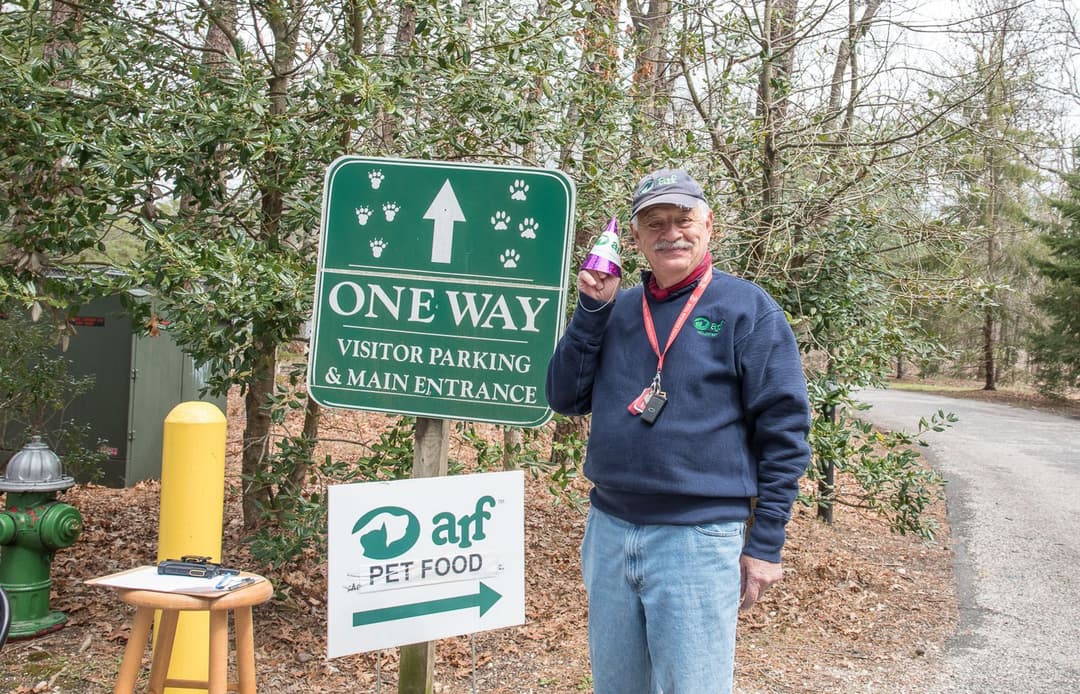 Volunteer Paul Hecht greet visitors.