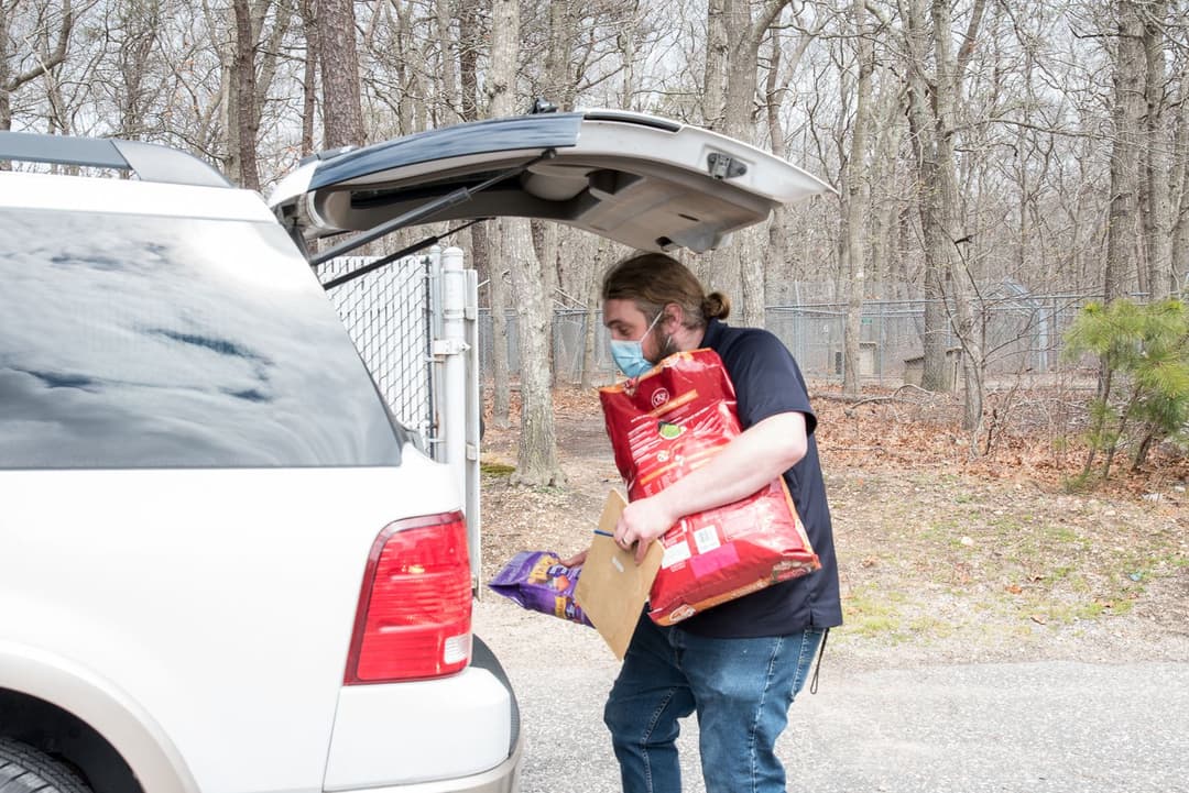 ARF's Jake Kommer helps unload donations.