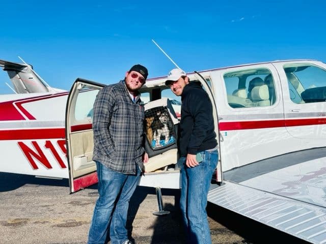Pilots Jan Brentjens and Matthew Pellegrino pose with the precious cargo.